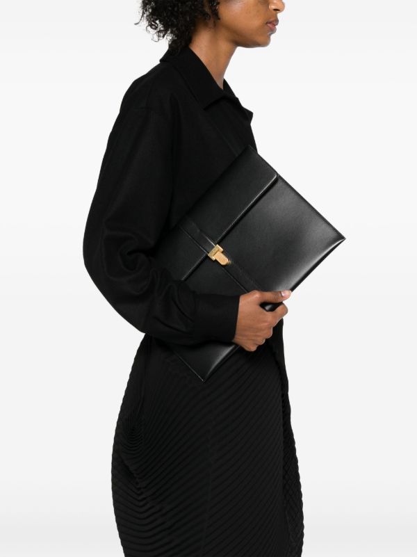 The Row Black Leather Clutch Bag | Browns Clutch Bags