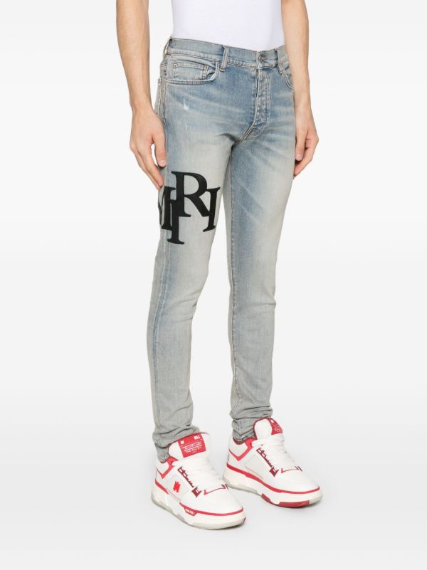 AMIRI Staggered-Logo Jeans | Browns Skinny Jeans