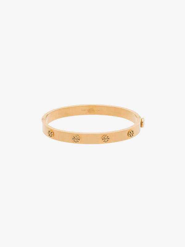 Tory Burch gold tone Miller hinge stud bangle | Browns Bracelets