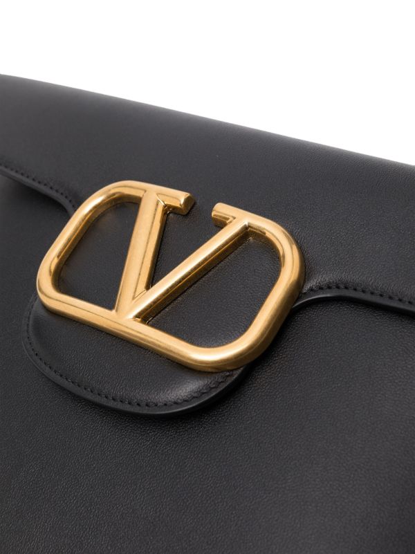 Valentino Garavani Black Locò Leather Clutch Bag | Browns Clutch Bags