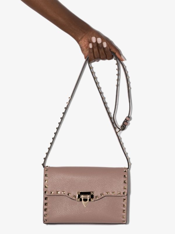 Valentino Garavani pink Rockstud leather cross body bag | Browns Messenger & Crossbody Bags